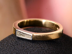 thumbnail of EB 0.19ct Tapered Diamond Baguette Ring in Yellow Gold and Platinum (right angle view on dark pink background)