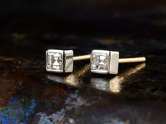 thumbnail of Angled front view of 0.35cttw Square Step Cut White Diamonds in Platinum Bezels with Yellow Gold Posts, Shown on dark textured background.