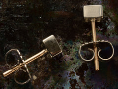 thumbnail of Sides of a pair of 0.52cttw Square Step Cut Diamonds Studs in Platinum Bezels with Yellow Gold Posts (on dark textured background)