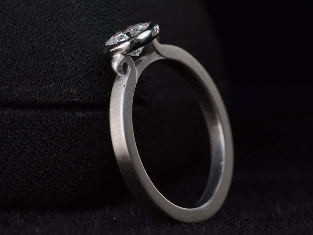 EB Round Step Cut Platinum Ring (opposite side angle view on dark background)