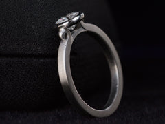 thumbnail of EB Round Step Cut Platinum Ring (opposite side angle view on dark background)