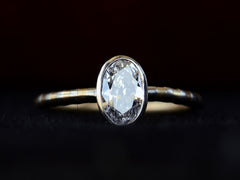 thumbnail of Front view of EB 0.69ct Oval Diamond Ring with Platinum Bezel and Striped Gold and Platinum Band (shown on dark background)