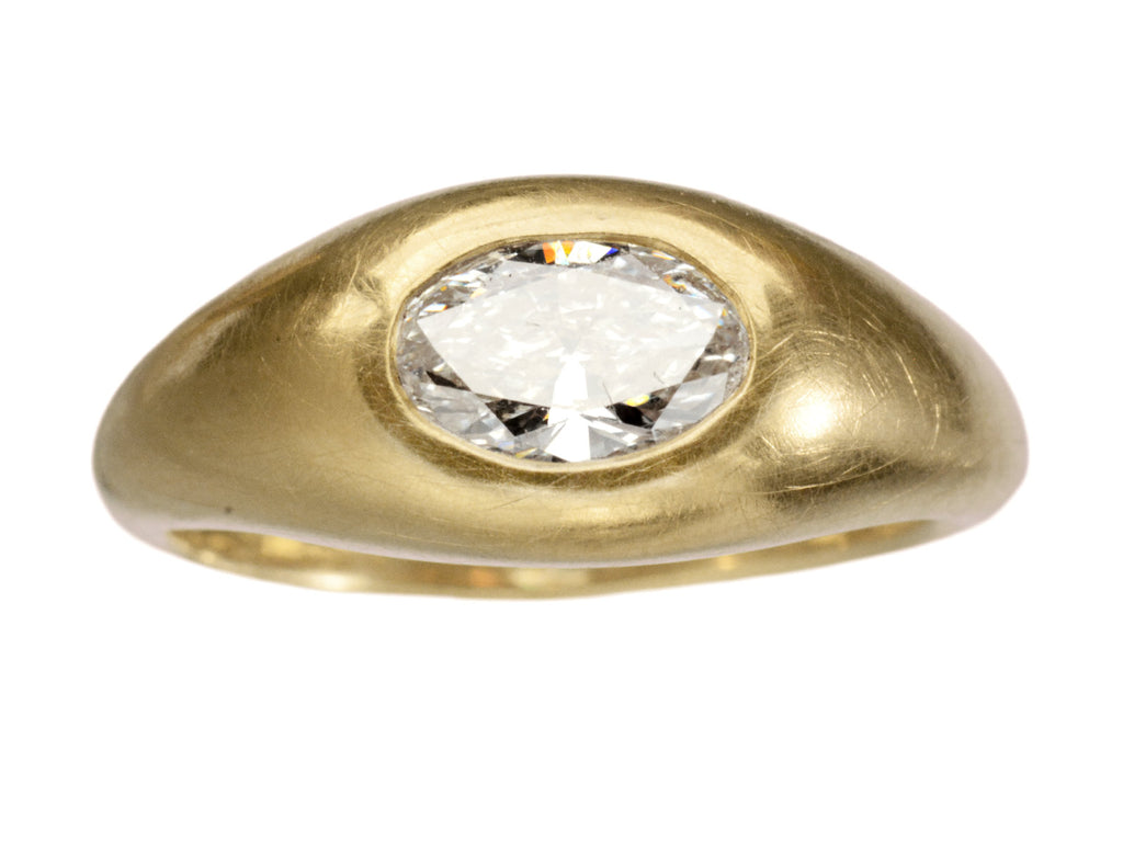 Front view of EB Modern flush set oval white diamond in rounded 22K yellow gold setting, shown on white background.