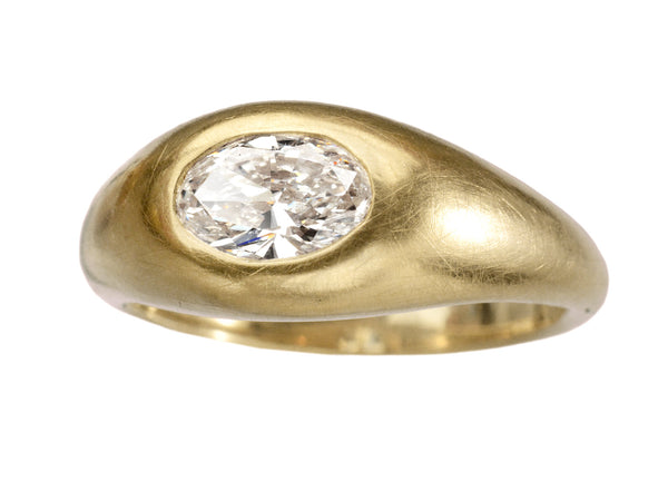 Right angled front view of EB Modern flush set oval white diamond in rounded 22K yellow gold setting, shown on white background.