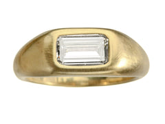thumbnail of EB Modern engagement ring with elongated emerald cut diamond flush set in a rounded 22k yellow gold mounting, on white background.
