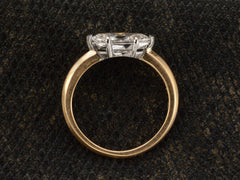 thumbnail of Side profile view of EB Modern engagement ring solitaire with marquise diamond set in platinum prongs with an 18K yellow gold knife edge shank, shown on dark textured background.