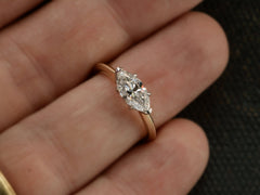 thumbnail of Front view of EB Modern engagement ring solitaire with marquise diamond set in platinum prongs with an 18K yellow gold knife edge shank, shown on finger