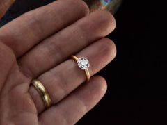 thumbnail of EB Modern engagement ring with 1.42ct round diamond set in platinum bezel with round 18K yellow gold shank. Shown on finger.