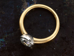 thumbnail of Side profile of EB Modern engagement ring with 1.42ct round diamond set in platinum bezel with round 18K yellow gold shank. Shown on dark background. 
