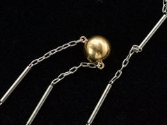 thumbnail of Detail of EB Modern necklace with domed 22K yellow gold bead (the reverse side of the diamond) on platinum chain. Shown on black background.