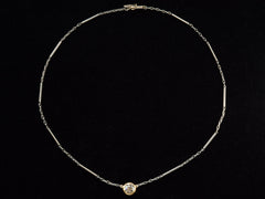 thumbnail of EB Modern necklace with old cut round diamond shown in 22k yellow gold bezel  on platinum chain. Shown on black background.
