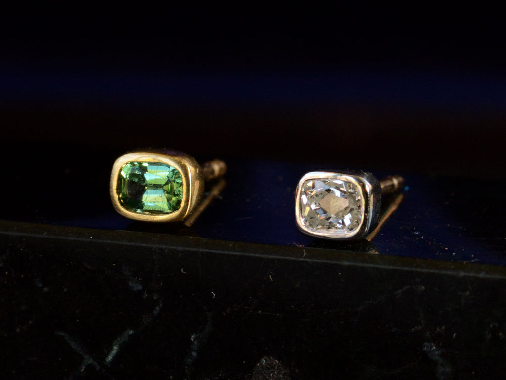  Mismatched EB Modern Diamond and Green Sapphire Stud Earrings (angled view on black background))