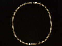 thumbnail of Curb link yellow gold chain necklace with a platinum bezel set rose cut diamond, shown on black background.