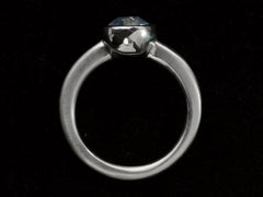 thumbnail of Side profile of a round opalescent light blue sapphire in a platinum bezel with a rounded matte platinum shank, shown on black background.