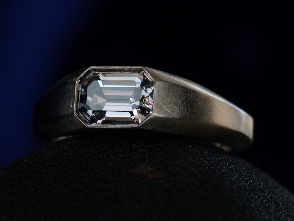 Right angle view of EB Purple Spinel Signet Ring In Platinum (shown on black background)