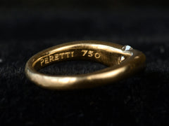 thumbnail of Detail view of the inside of vintage gold ring stamped with "PERETTI 750" shown on dark background.