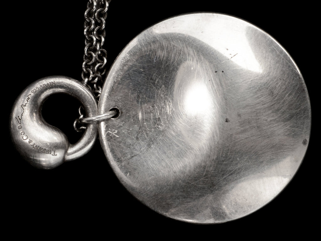 Pair of organic and minimal silver Elsa Peretti pendants, with detail of signature on smaller pendant which reads "TIFFANY & CO Elsa Peretti 925 SPAIN" 