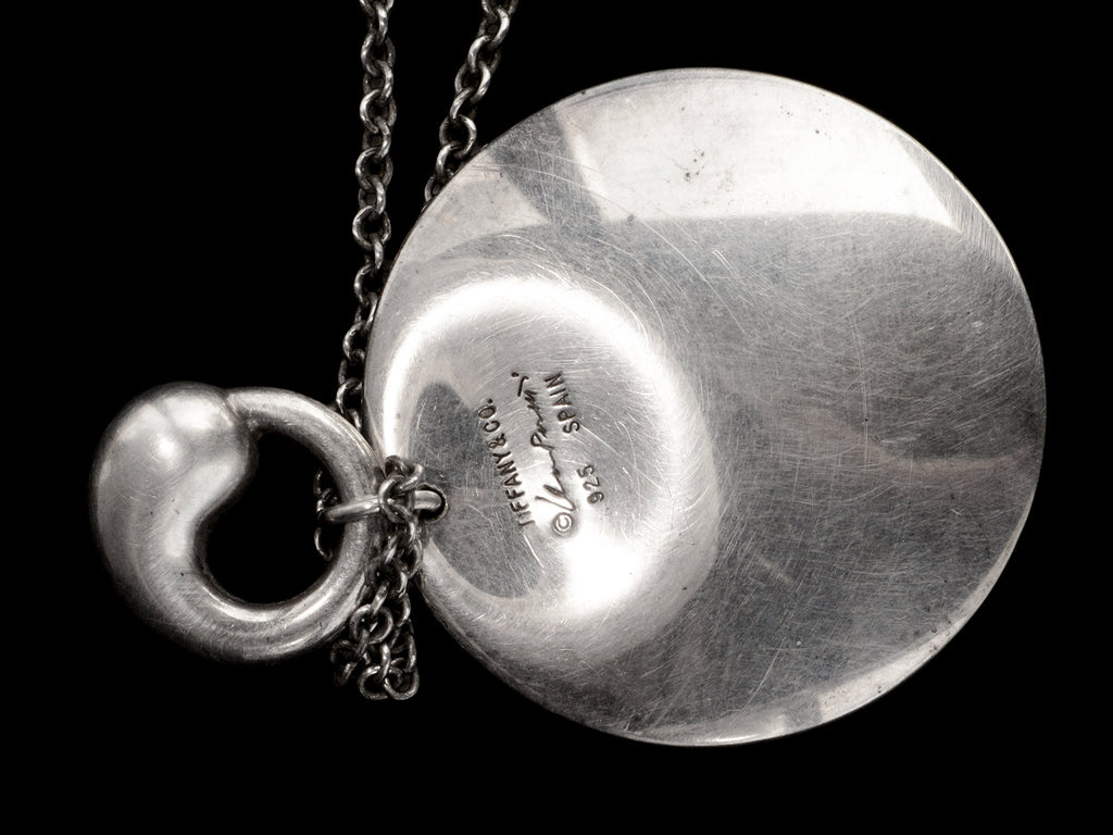 Pair of organic and minimal silver Elsa Peretti pendants, with detail of signature on larger pendant which reads "TIFFANY & CO Elsa Peretti 925 SPAIN" 