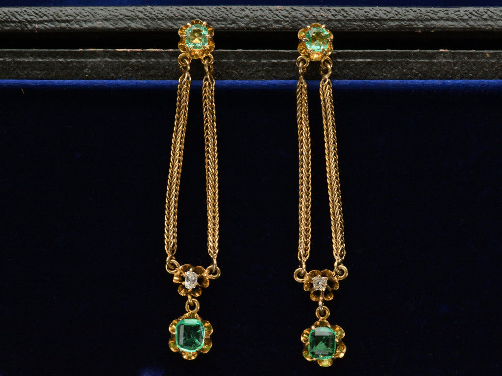 c1900 Emerald and Diamond Drop Earrings in Yellow Gold (on dark background)