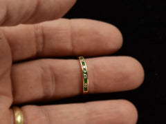 thumbnail of Vintage gold ring with alternating emeralds and diamonds on finger