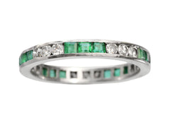 thumbnail of Vintage platinum eternity ring with alternating emeralds and diamonds on a white background

