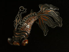 thumbnail of Front view of a vintage c1950 Chinese articulated fish pendant with orange enamel and filigree, shown on dark background.