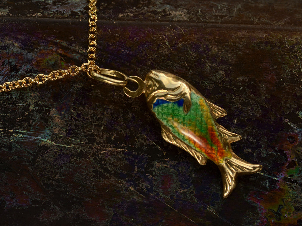 Reverse side of c1970 Blue, Green and Orange Enamel Fish Pendant in Gold (on dark background) 