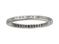 thumbnail of A thin vintage diamond eternity band in platinum, shown on white background.