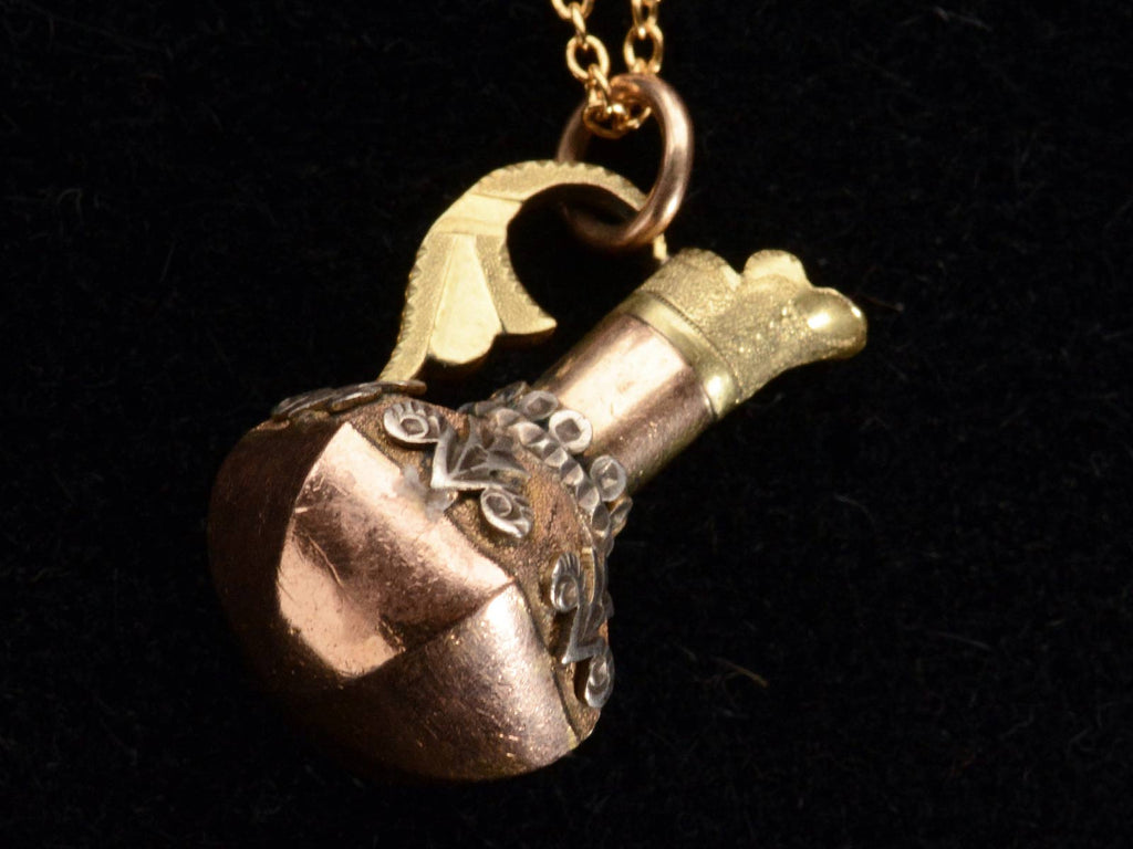 Reverse view of c1900 Turkish Ewer Pendant with Silver and Rose and Green Gold Details. Shown on  black background.