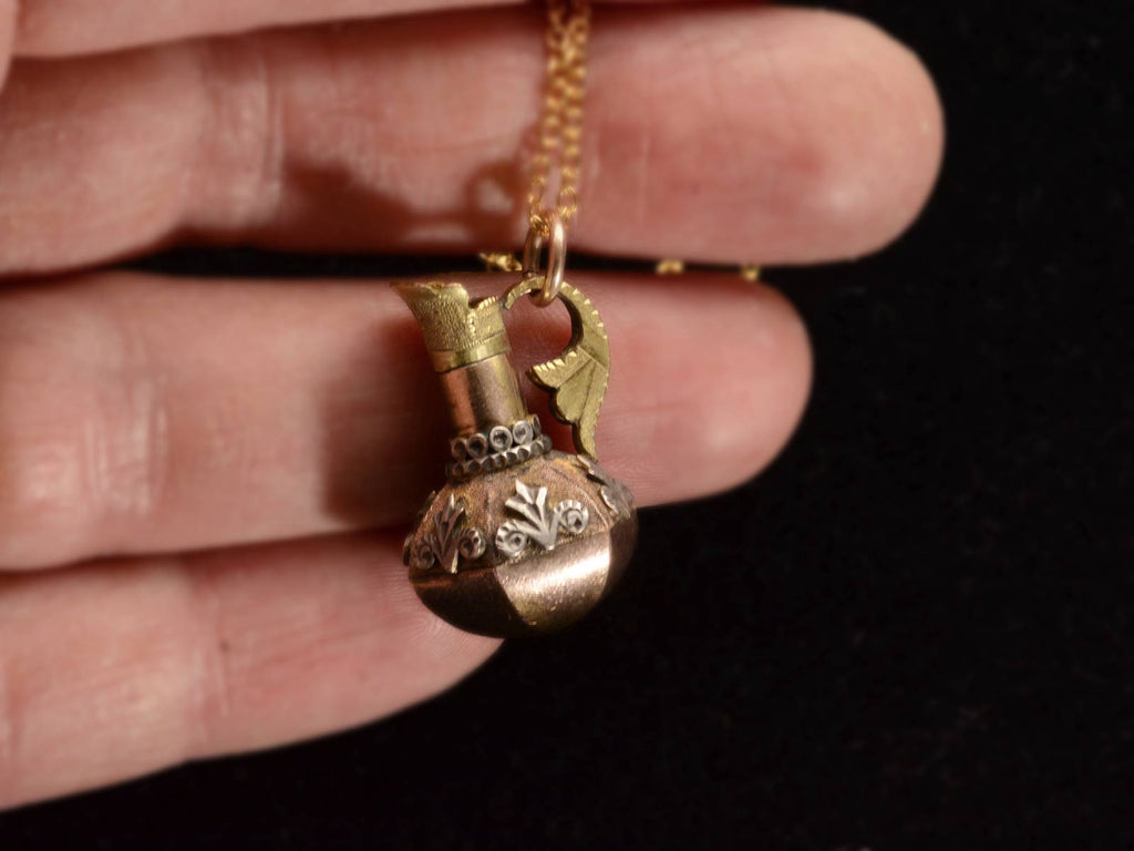 c1900 Turkish Ewer Pendant with Silver and Rose and Green Gold Details. Shown in hand for scale.