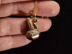 thumbnail of c1900 Turkish Ewer Pendant with Silver and Rose and Green Gold Details. Shown in hand for scale.