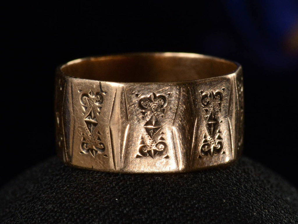 Front view of c1880 Faceted Cigar Band in Rose Gold (shown on black background)