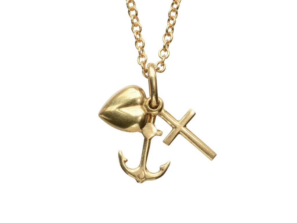 Vintage gold necklace with heart, anchor, and cross pendant on a white background