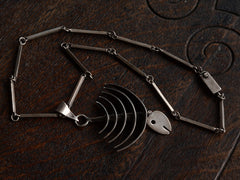 thumbnail of Detail of c1970 Silver Fish Skeleton Necklace (shown on dark wood background)