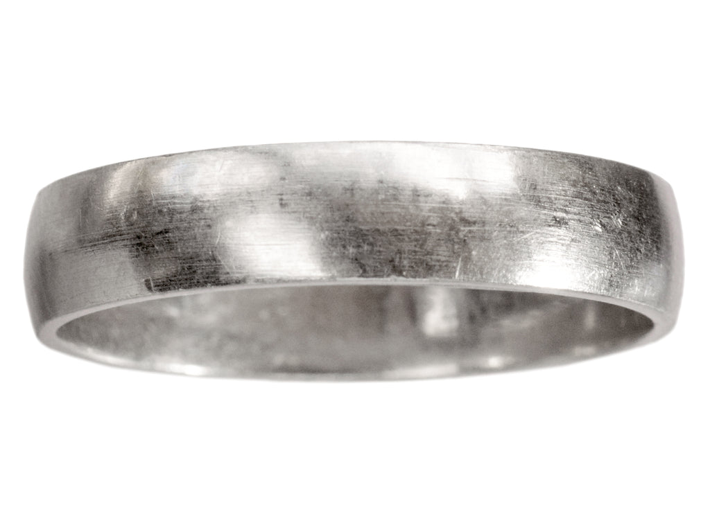 A vintage c1980 flat men's wedding band in platinum, shown on white background