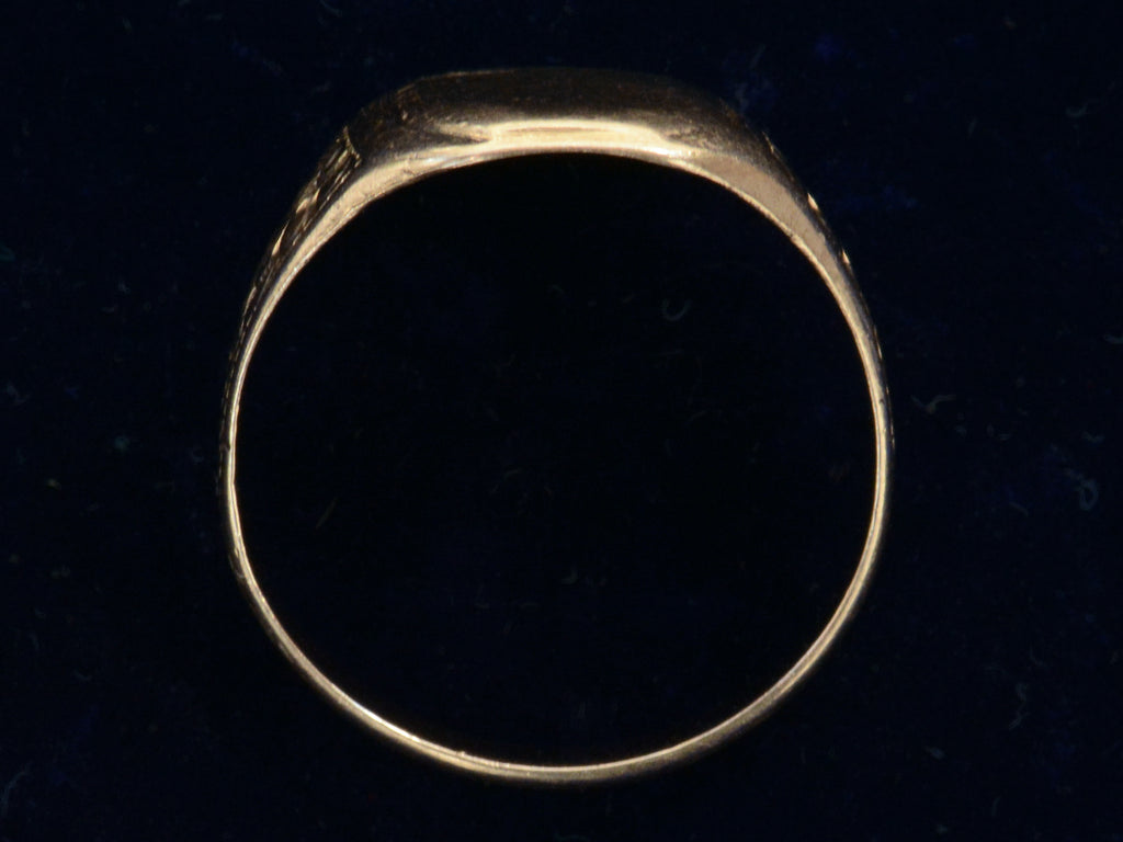 Profile view of 1900's Men's Floral Rosy Gold Signet Ring (on black background)