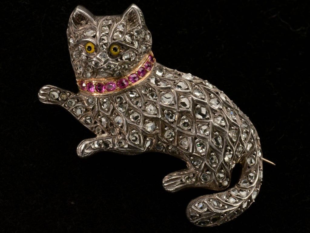 Front view of c1880 Pet Cat Brooch with Diamond and Rubies (shown on black background)