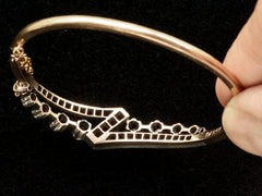 thumbnail of Reverse inside view of an antique French silver topped yellow gold bracelet with a zig-zag of rose cut diamonds, shown on black background.
