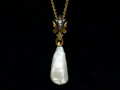 thumbnail of Detail of antique pendant with rose cut diamond and yellow gold top and large baroque pearl drop (shown on black background)