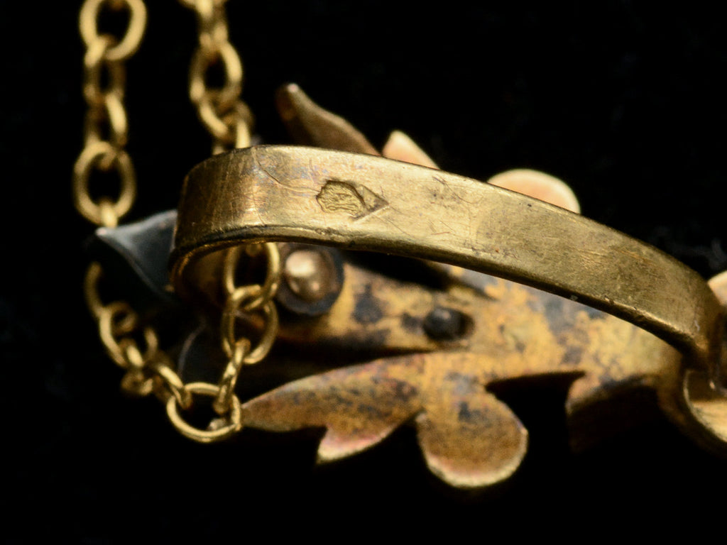 Close up of pendant bale showing French eagle hallmark.