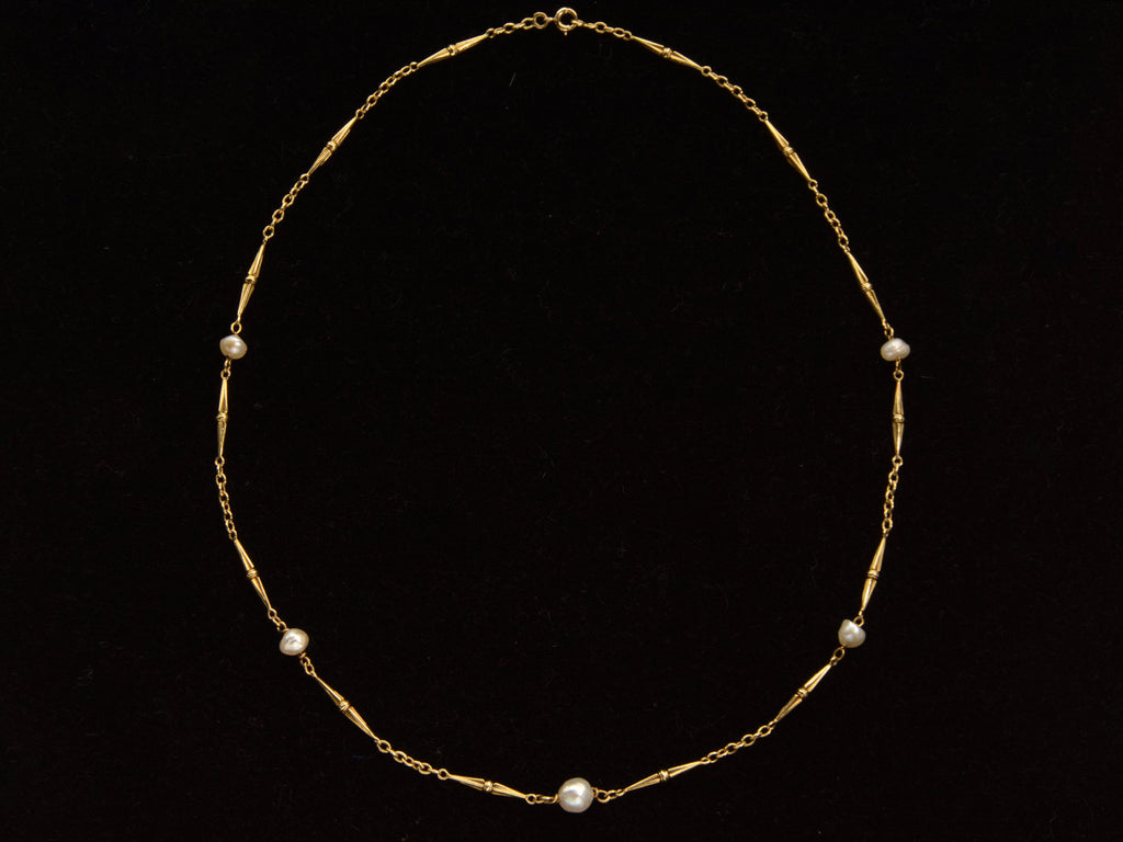  c1920 French Art Deco gold chain necklace with interspersed pearls, shown on black background