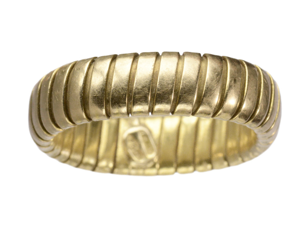 A flexible gaspipe-link 18k yellow gold band, shown on white background.