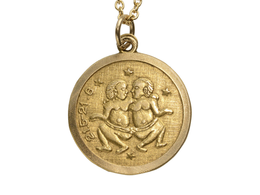 c1970 Round Yellow Gold Pendant with Gemini Twins and the numbers "21.5-21.6." (shown on white background)