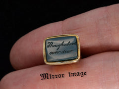 thumbnail of c1820 Intaglio Motto Seal (on finger for scale)