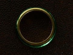 thumbnail of Side profile of heavy vintage 18K yellow gold rounded band with dark green enamel, shown on dark textured background.