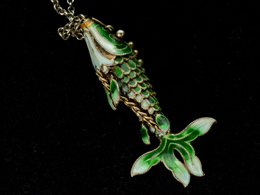 Underside detail of c1960 Green Enamel Fish Pendant (on black background)