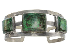 thumbnail of A silver cuff bracelet featuring three rectangular green malachite stone inlays, set against a plain white background.
