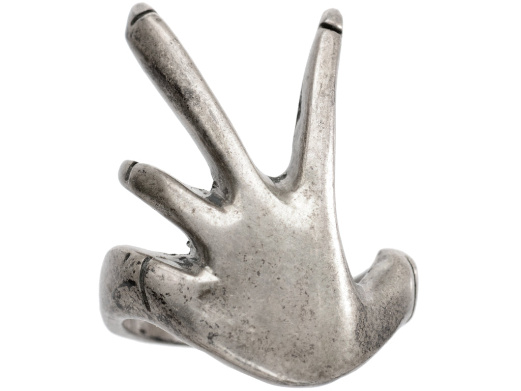 c1970 Hand shaped silver ring, shown on white background