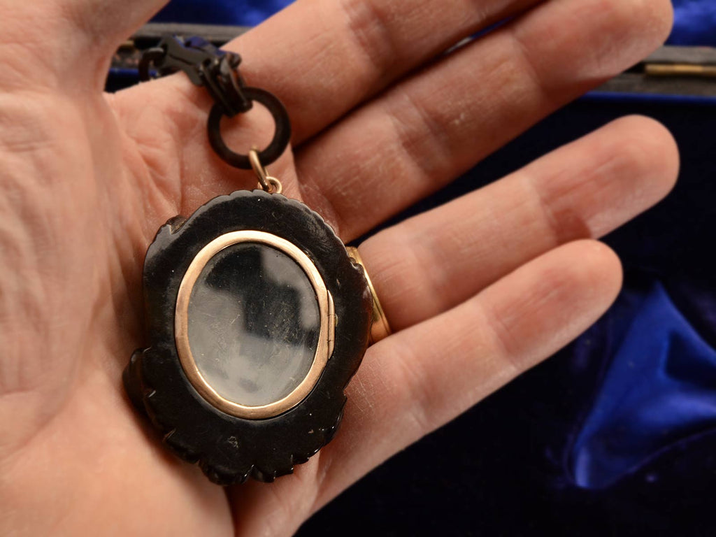 Reverse side showing locket compartment of c1870 Hermes Pendant (on hand for scale)