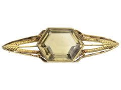 thumbnail of Antique Art Deco brooch with hexagonal citrine and gold wings, shown on white background.